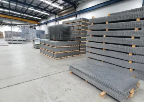 Industrial site perimeter protected with mesh fence panels